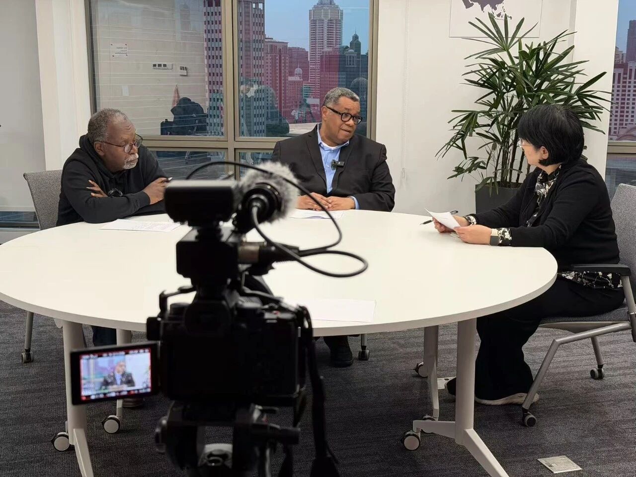 An in-depth dialogue between Professor Lu Xinyu, Honorable Tanoh, and Mr. Opoku.